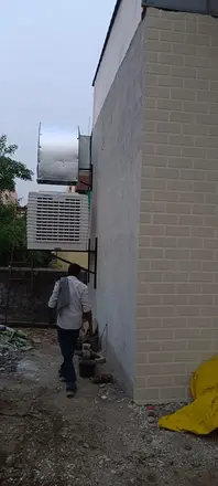Duct cooler beside a building